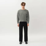 Styled full-body front view of the Wide Flextech™ Jeans in black