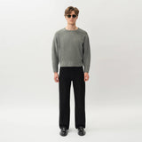 Styled full-body front view of the Wide Flextech™ Jeans in black