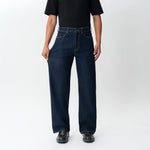 Full-body view showing the stretch of the Wide Flextech™ Jeans in dark blue