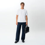 Full-body styled front view of the Wide Flextech™ Jeans in dark blue
