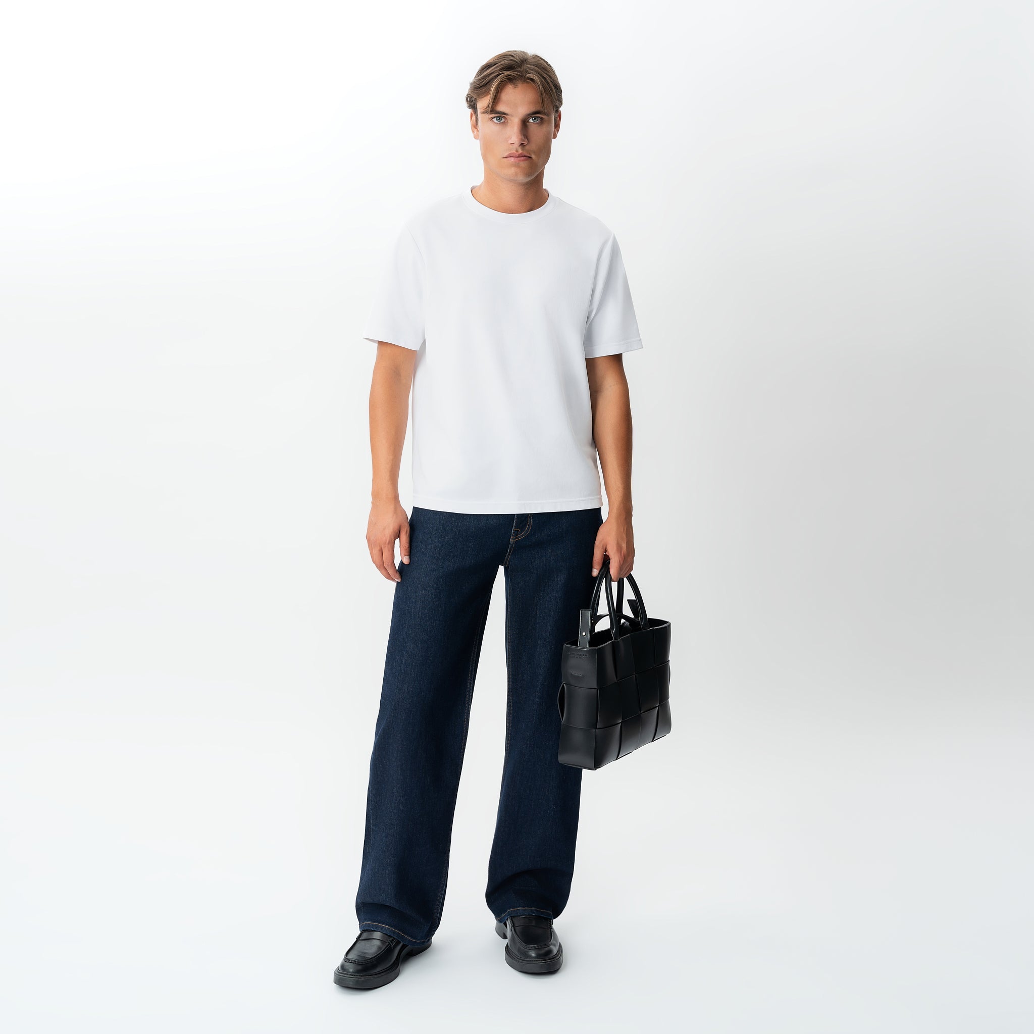 Full-body styled front view of the Wide Flextech™ Jeans in dark blue