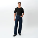 Styled full-body view of the Wide Flextech™ Jeans in dark blue