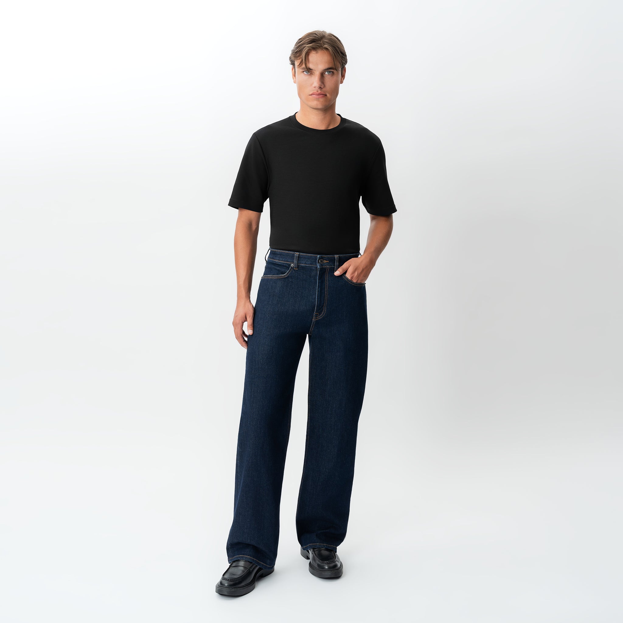 Styled full-body view of the Wide Flextech™ Jeans in dark blue