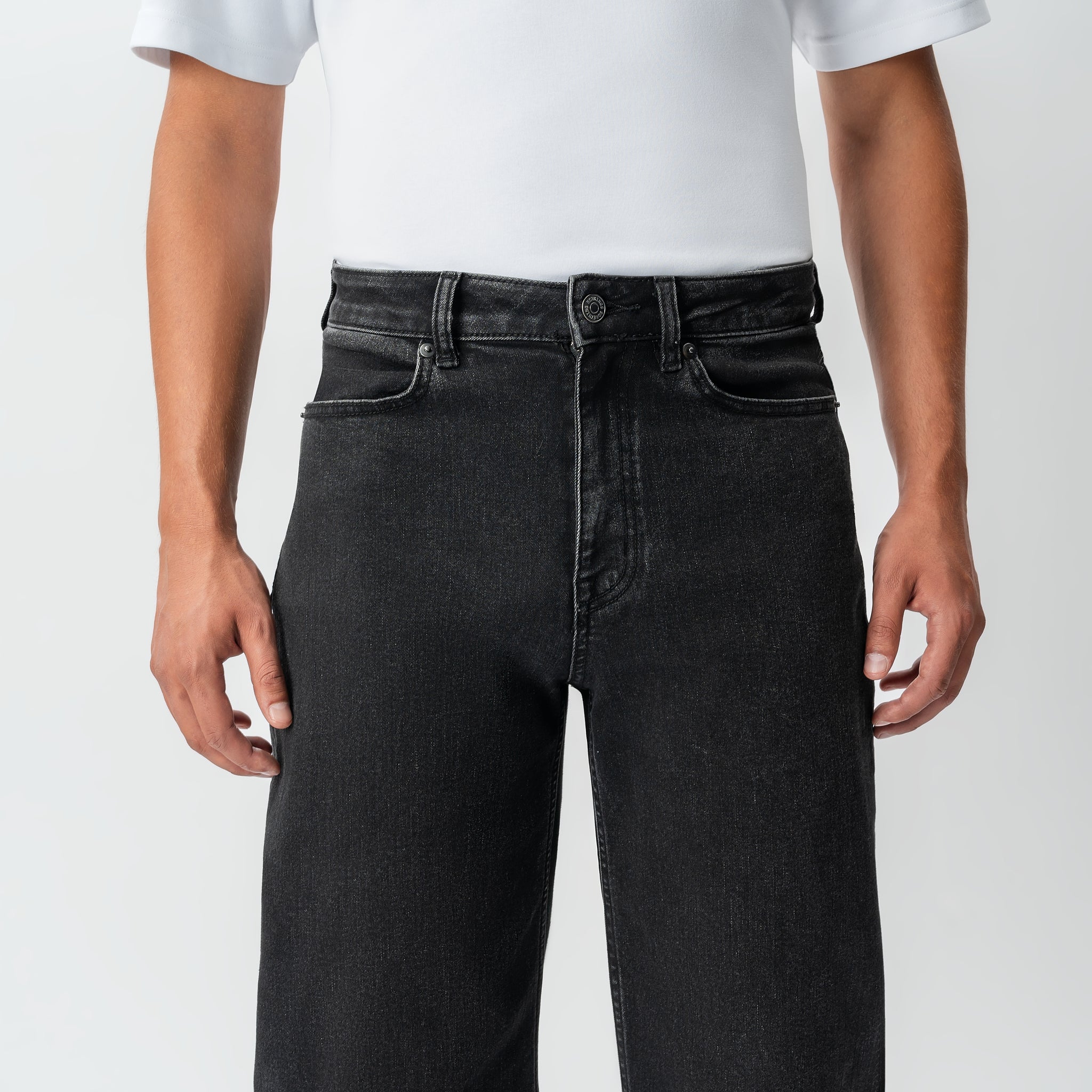 Detail of waistband and pocket construction on the Wide Flextech™ Jeans in faded black
