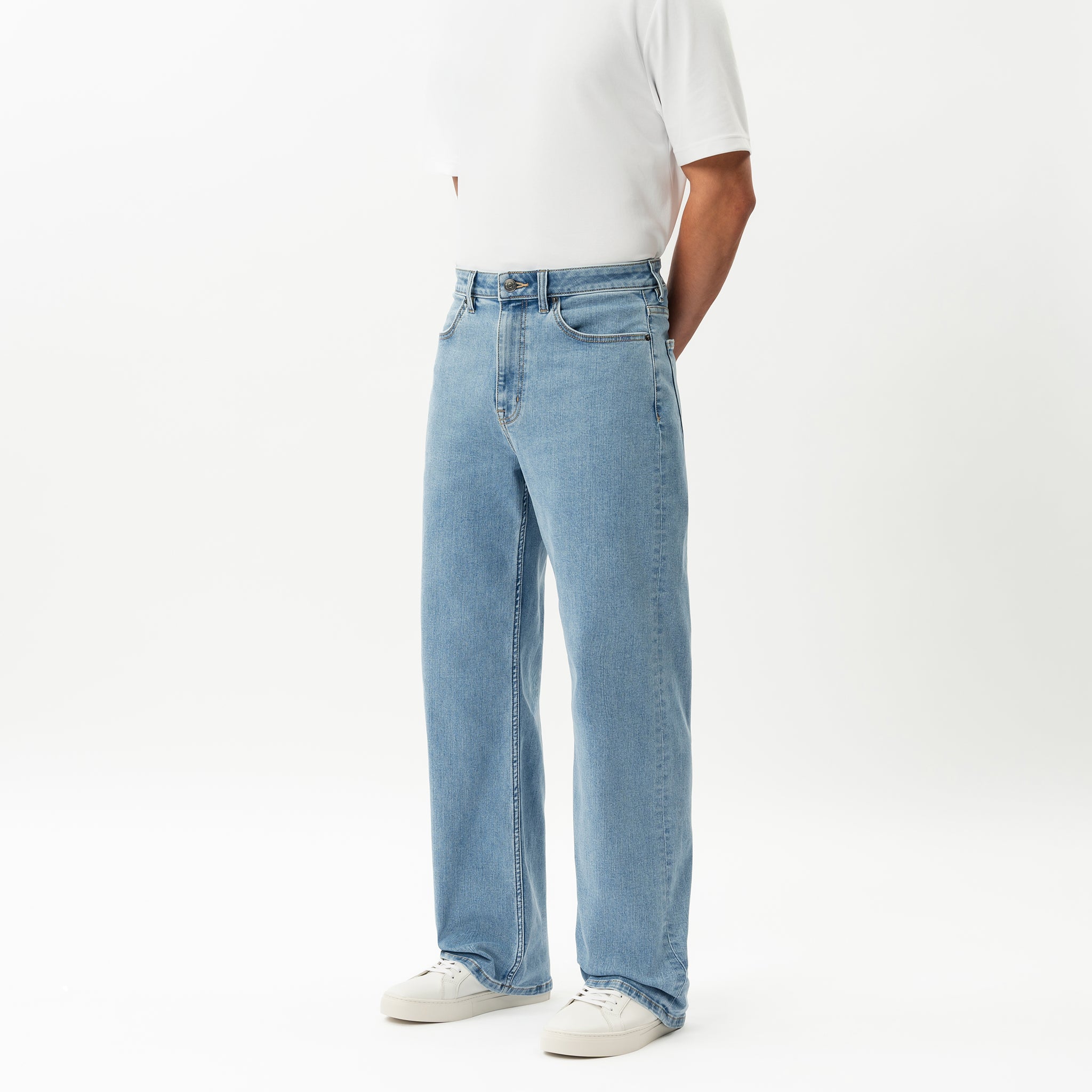 Angled view of the Wide Flextech™ Jeans in light blue showing the wide silhouette