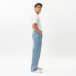 Side view of the Wide Flextech™ Jeans in light blue showing the wide silhouette