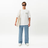 Styled full-body front view of the Wide Flextech™ Jeans in light blue