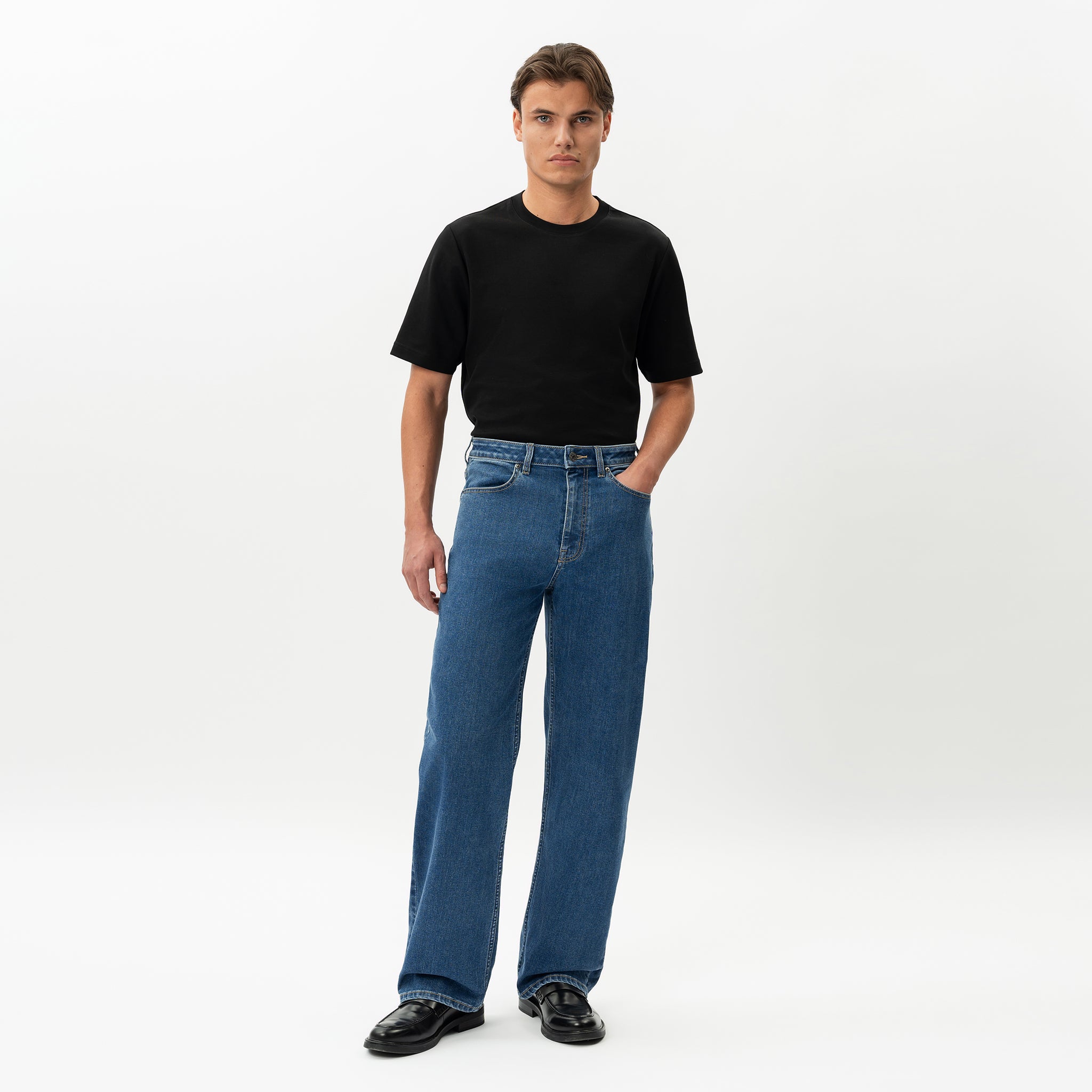 Full-body front view of the Wide Flextech™ Jeans in mid blue