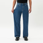 Close-up showing the stretch of the denim on the Wide Flextech™ Jeans in mid blue