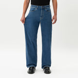 Close-up showing the stretch of the denim on the Wide Flextech™ Jeans in mid blue