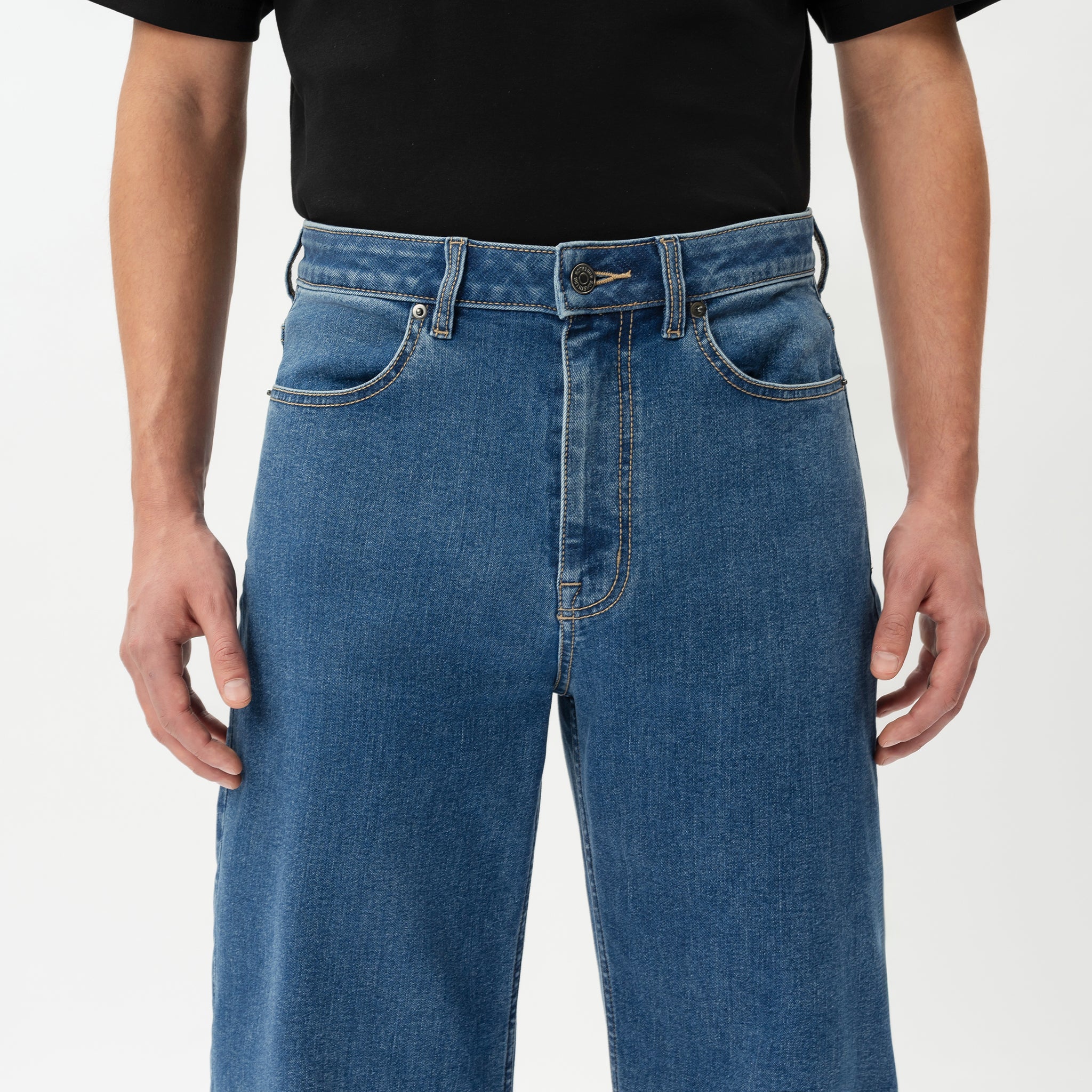 Detail of waistband and pocket construction on the Wide Flextech™ Jeans in mid blue