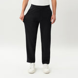 Detail showing the stretch of the black Socrates Classic straight-leg pant fabric at the waistband
