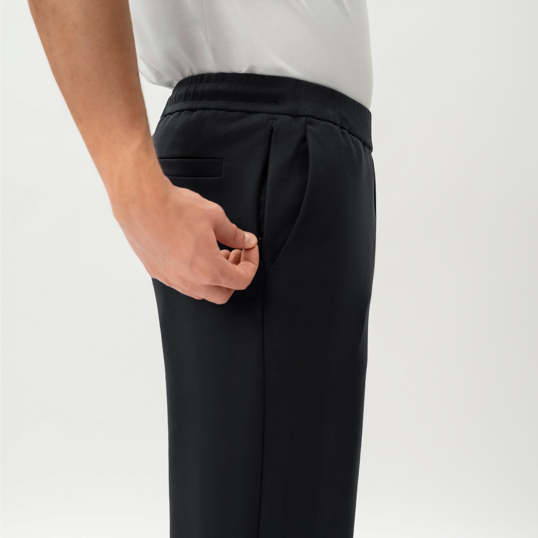 Detail of waistband and pocket construction on the black Socrates Classic straight-leg pant
