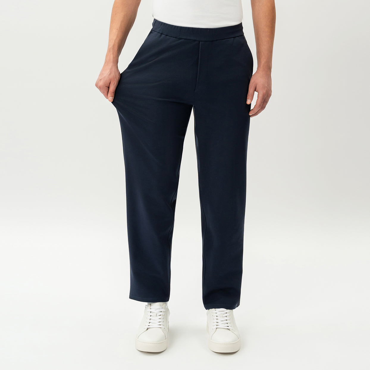 Half-body view showing the stretch of the navy Socrates Classic straight-leg pant fabric
