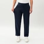 Half-body view showing the stretch of the navy Socrates Classic straight-leg pant fabric
