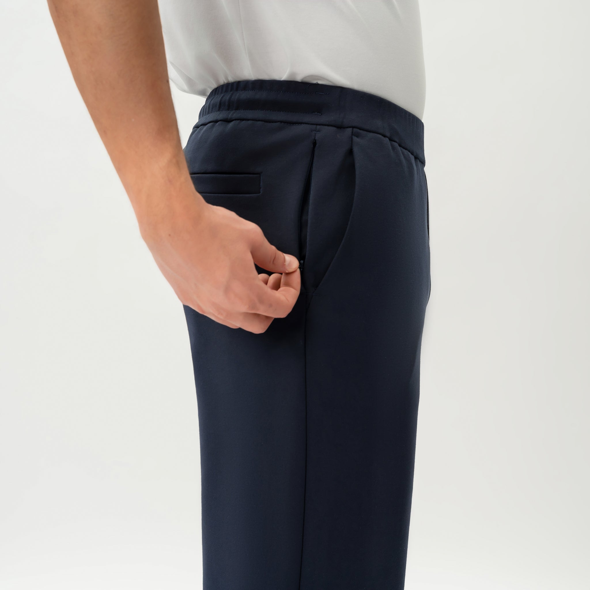 Detail of waistband and pocket construction on the navy Socrates Classic pant
