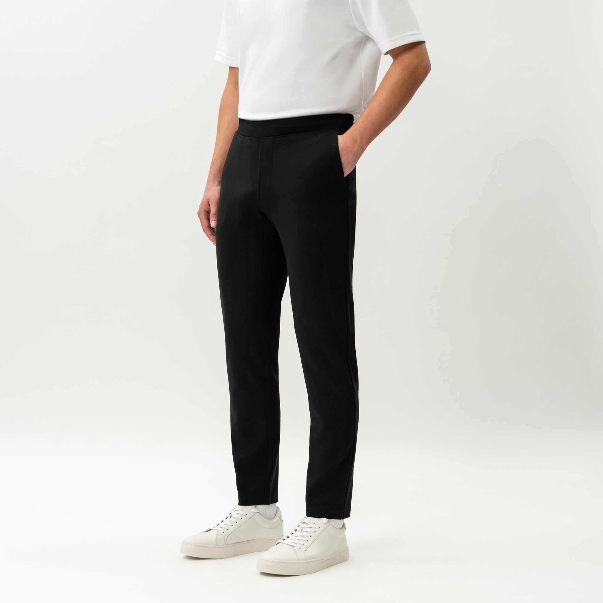 Angled front view of the Socrates Slim tapered pant in black
