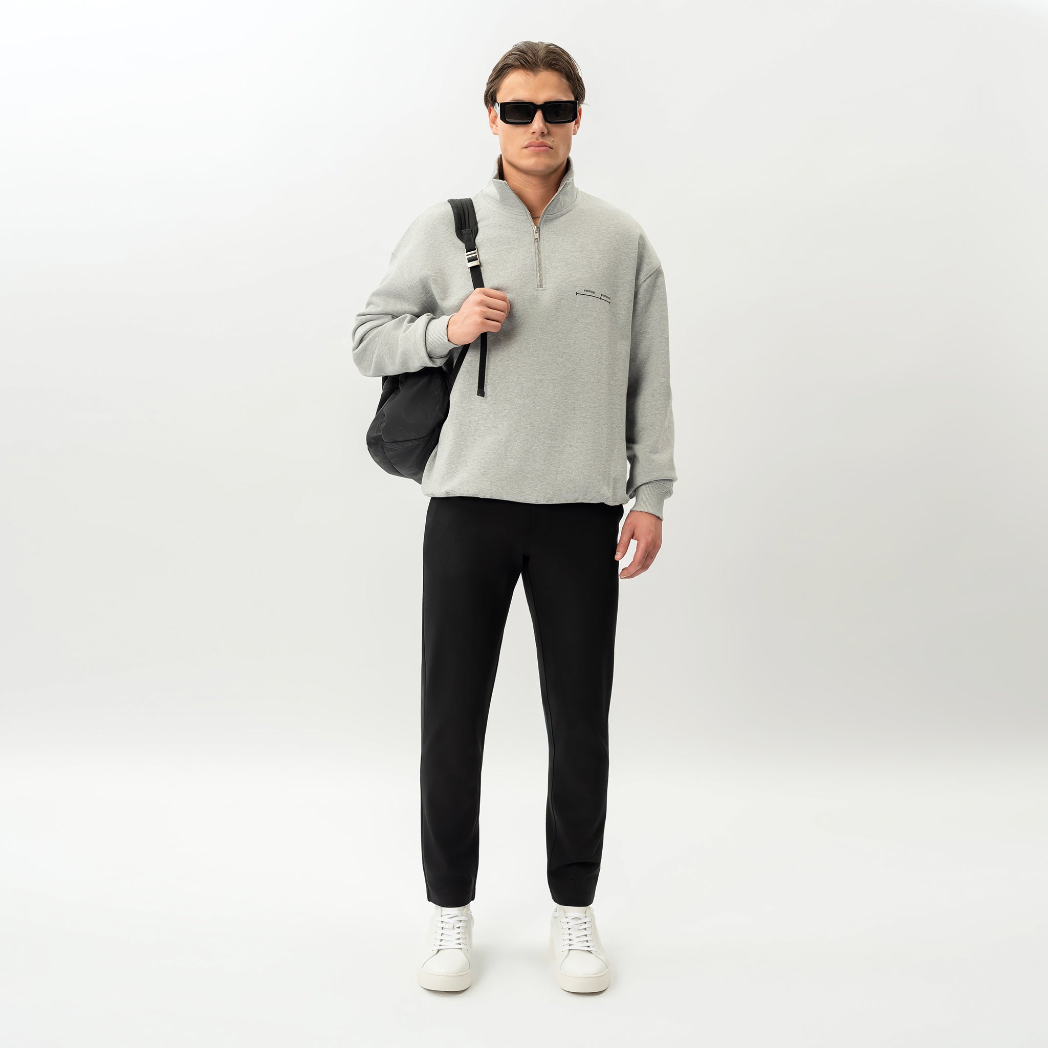 Styled look featuring the black Socrates Slim Pant worn as an everyday outfit
