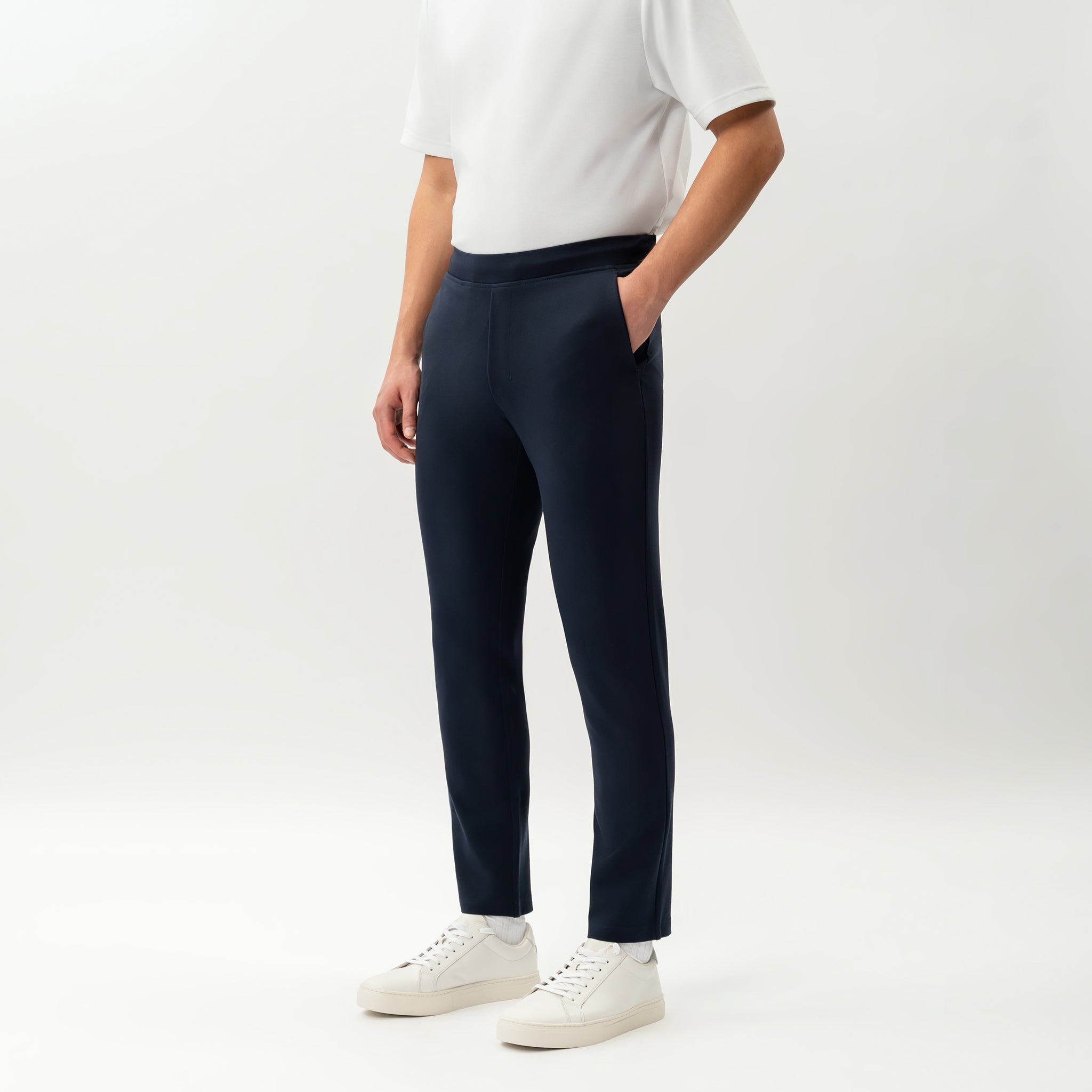 Angled front view of the Socrates Slim tapered pant in navy
