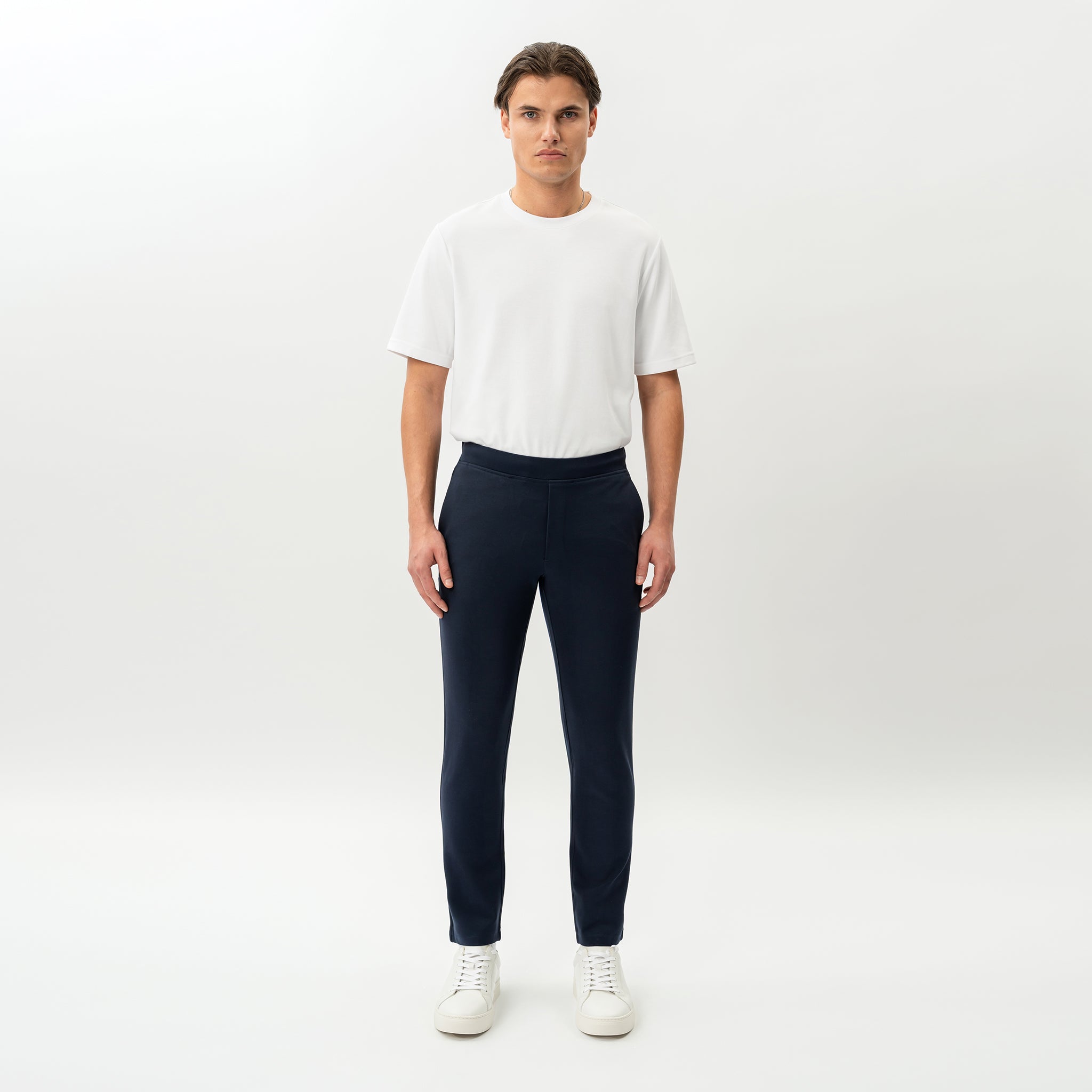 Full-body front view of the Socrates Slim tapered pant in navy
