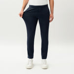 Detail showing the stretch of the navy Socrates Slim Pant fabric at the waistband
