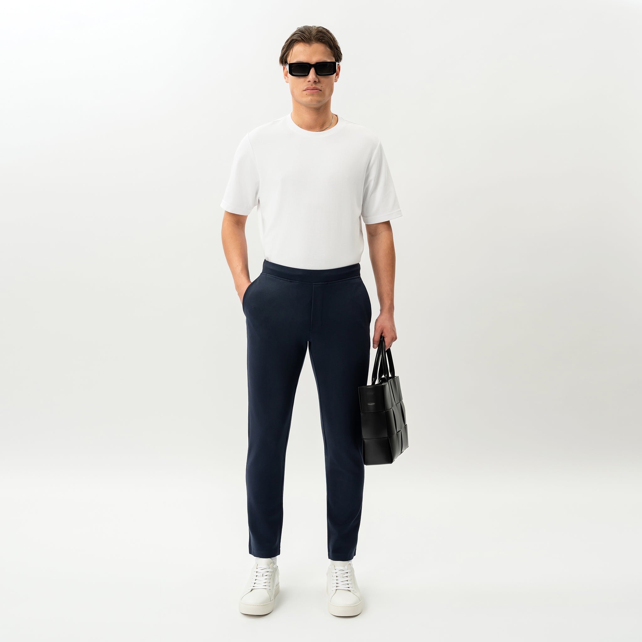Styled look featuring the navy Socrates Slim Pant worn as an everyday outfit
