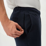 Detail of waistband and pocket construction on the navy Socrates Slim Pant
