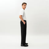 Side view of the Socrates wide-leg pant in black showing relaxed leg shape