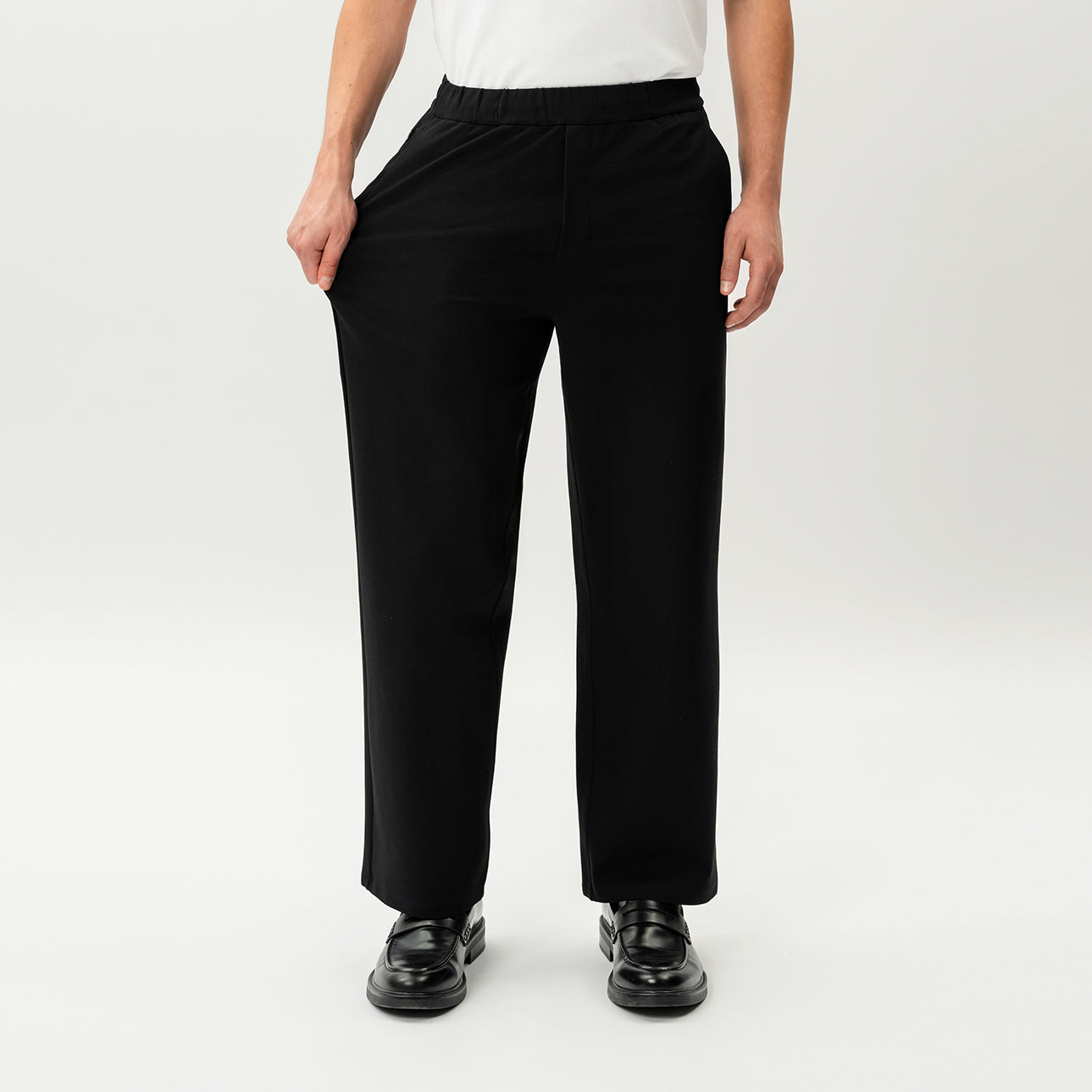 Detail showing the stretch of the black Socrates wide-leg pant fabric