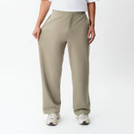 Full-body view showing the stretch of the khaki Socrates wide-leg pant fabric
