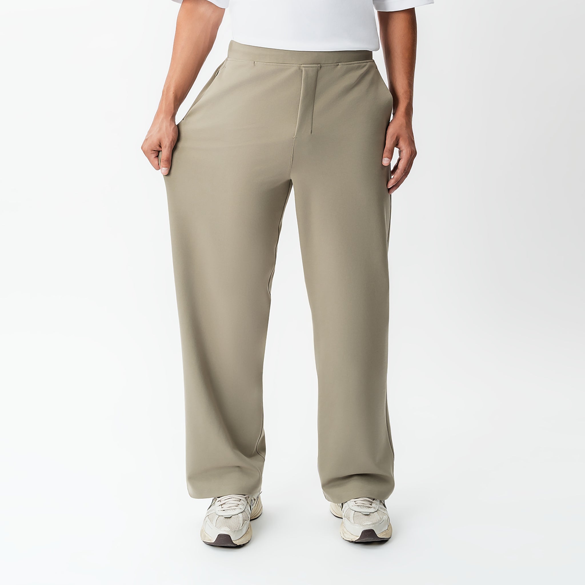 Full-body view showing the stretch of the khaki Socrates wide-leg pant fabric
