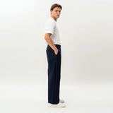 Side view of the Socrates wide-leg pant in navy showing relaxed leg shape