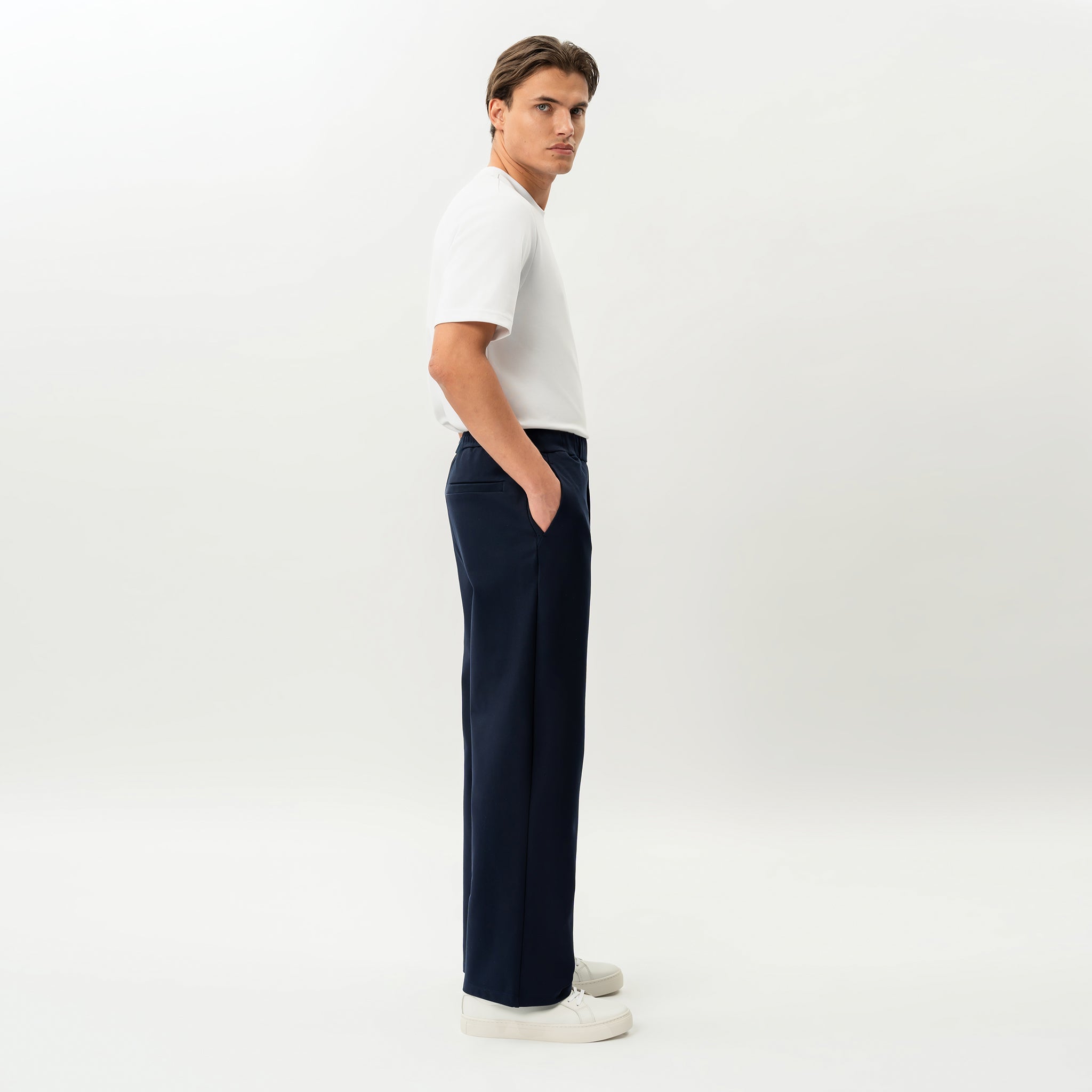 Side view of the Socrates wide-leg pant in navy showing relaxed leg shape