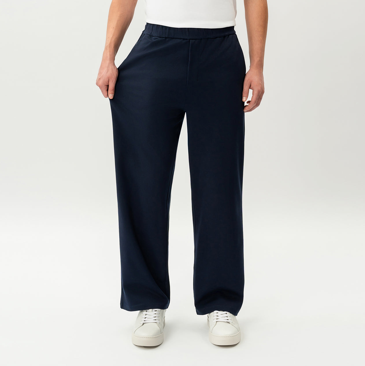 Detail showing the stretch of the navy Socrates wide-leg pant fabric