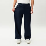 Detail showing the stretch of the navy Socrates wide-leg pant fabric
