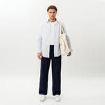 Styled look featuring the navy Socrates wide-leg pant worn as an everyday outfit