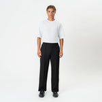 Front view of the black Socrates wide-leg pleated pant with relaxed stance