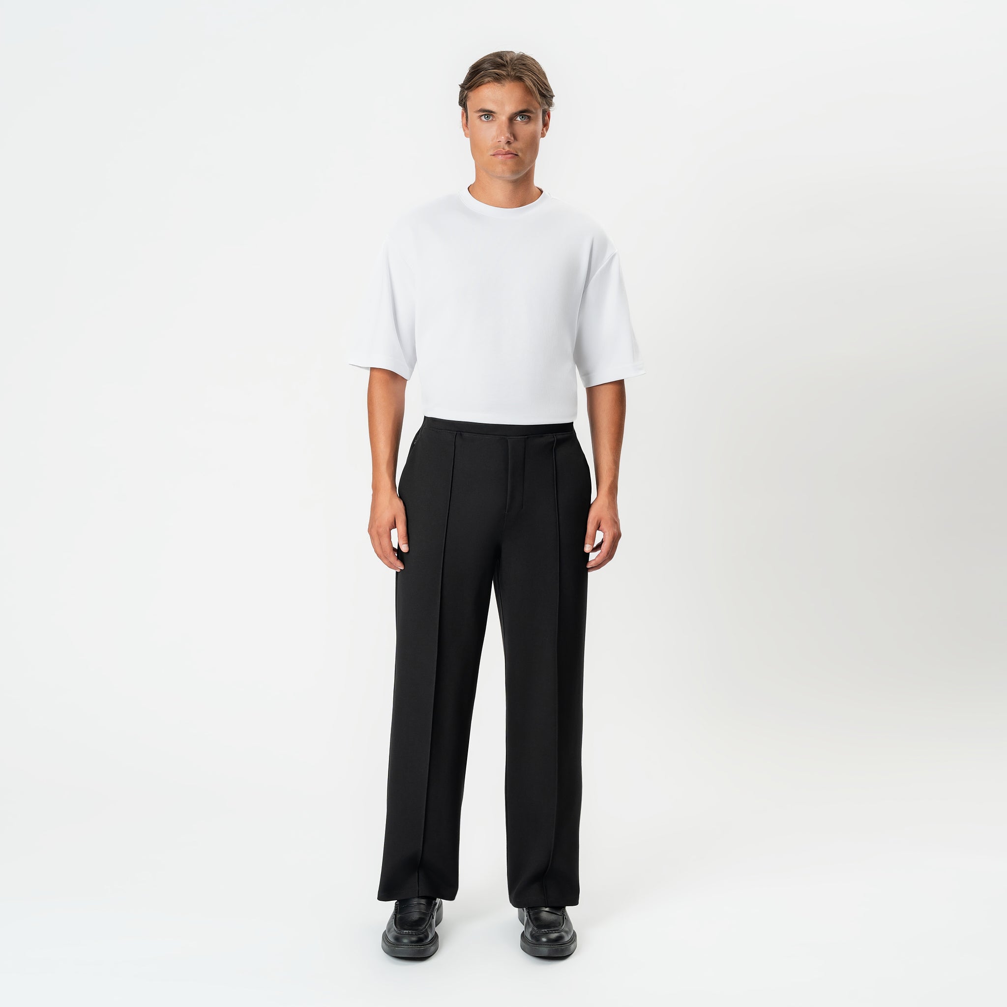 Front view of the black Socrates wide-leg pleated pant with relaxed stance